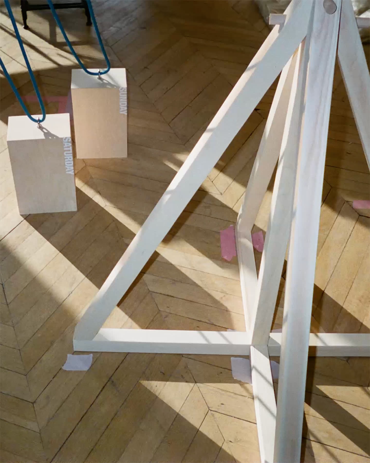 White sculptural installation and suspended blocks in the 24/7 project for Zara.