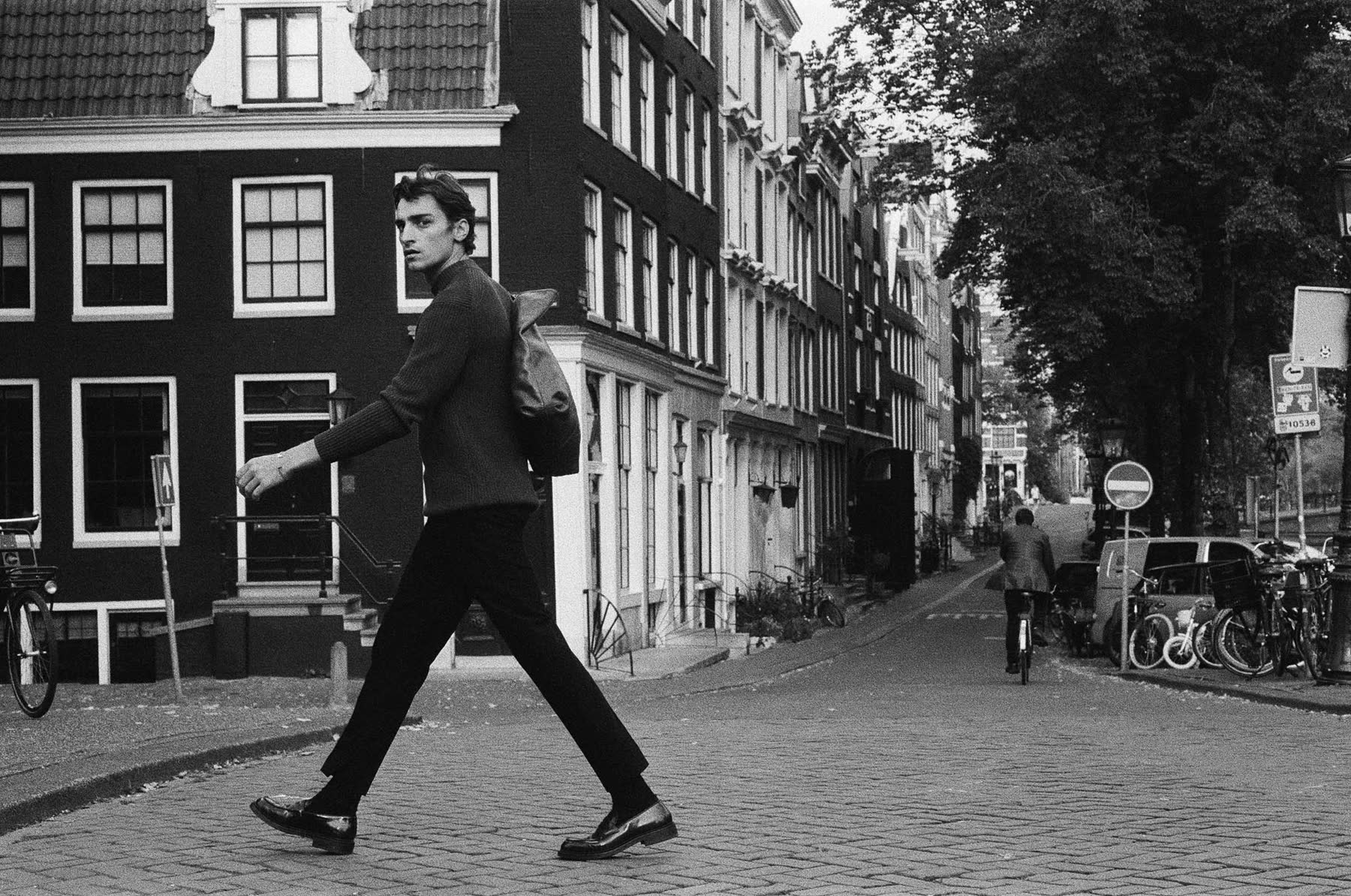 Michael walking through Amsterdam beside the canal for Zara.