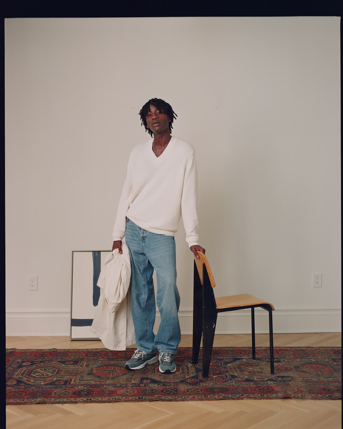 Cheikh Tall standing beside a chair in a brownstone interior for Zara.