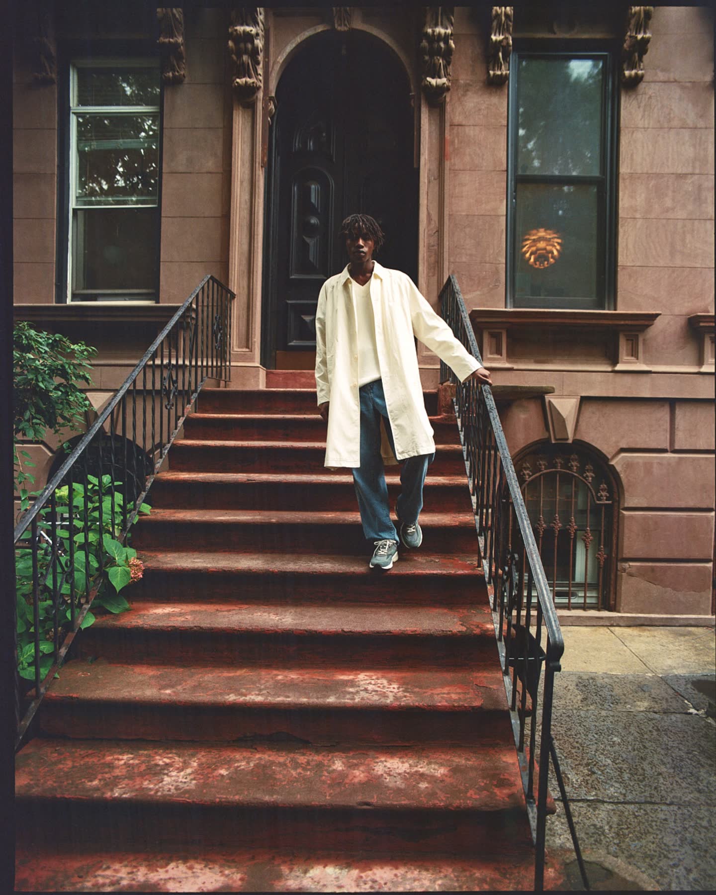 Cheikh Tall on the steps of a brownstone for Zara.
