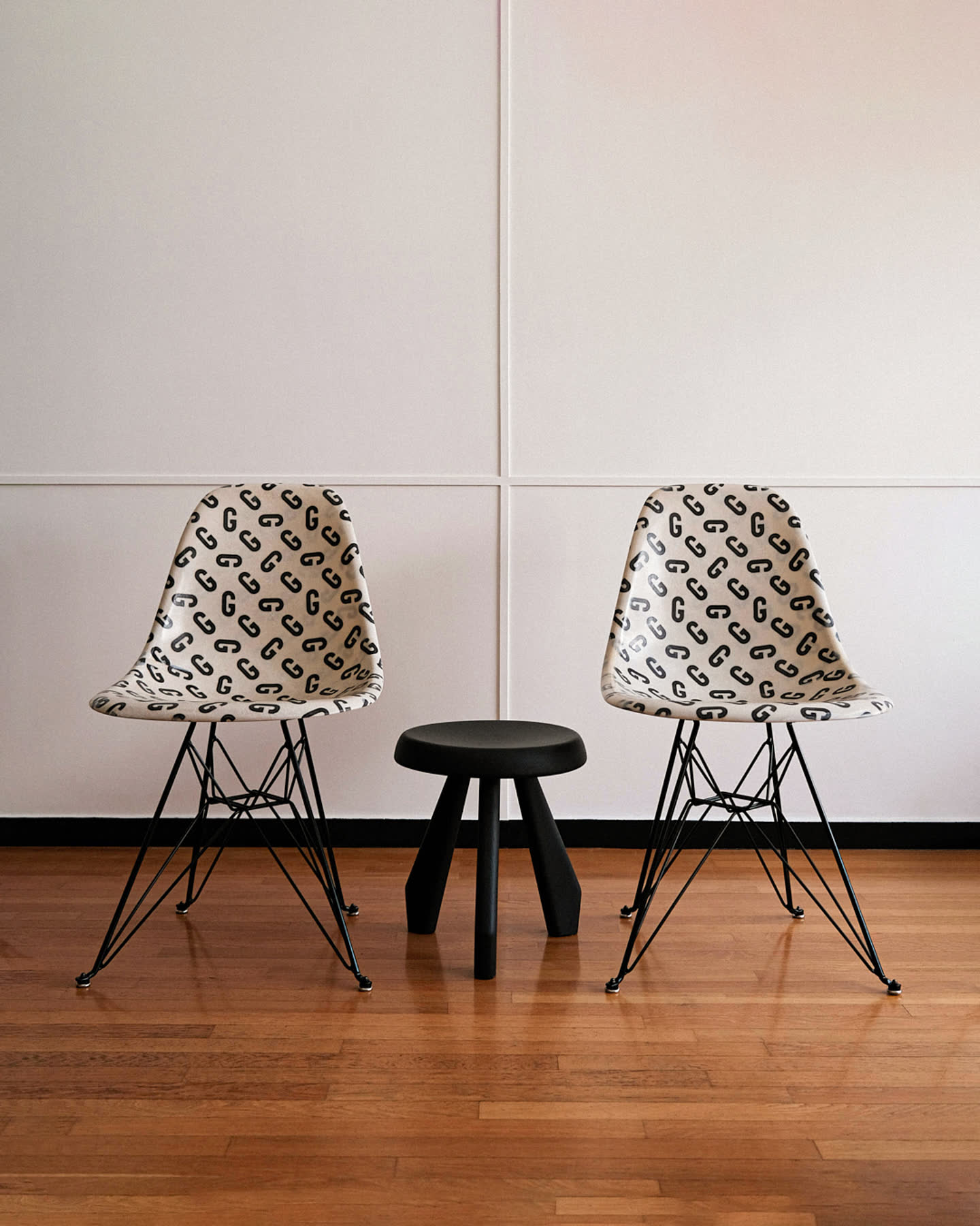 Two Goudron chairs and a black stool arranged inside Cité Radieuse.