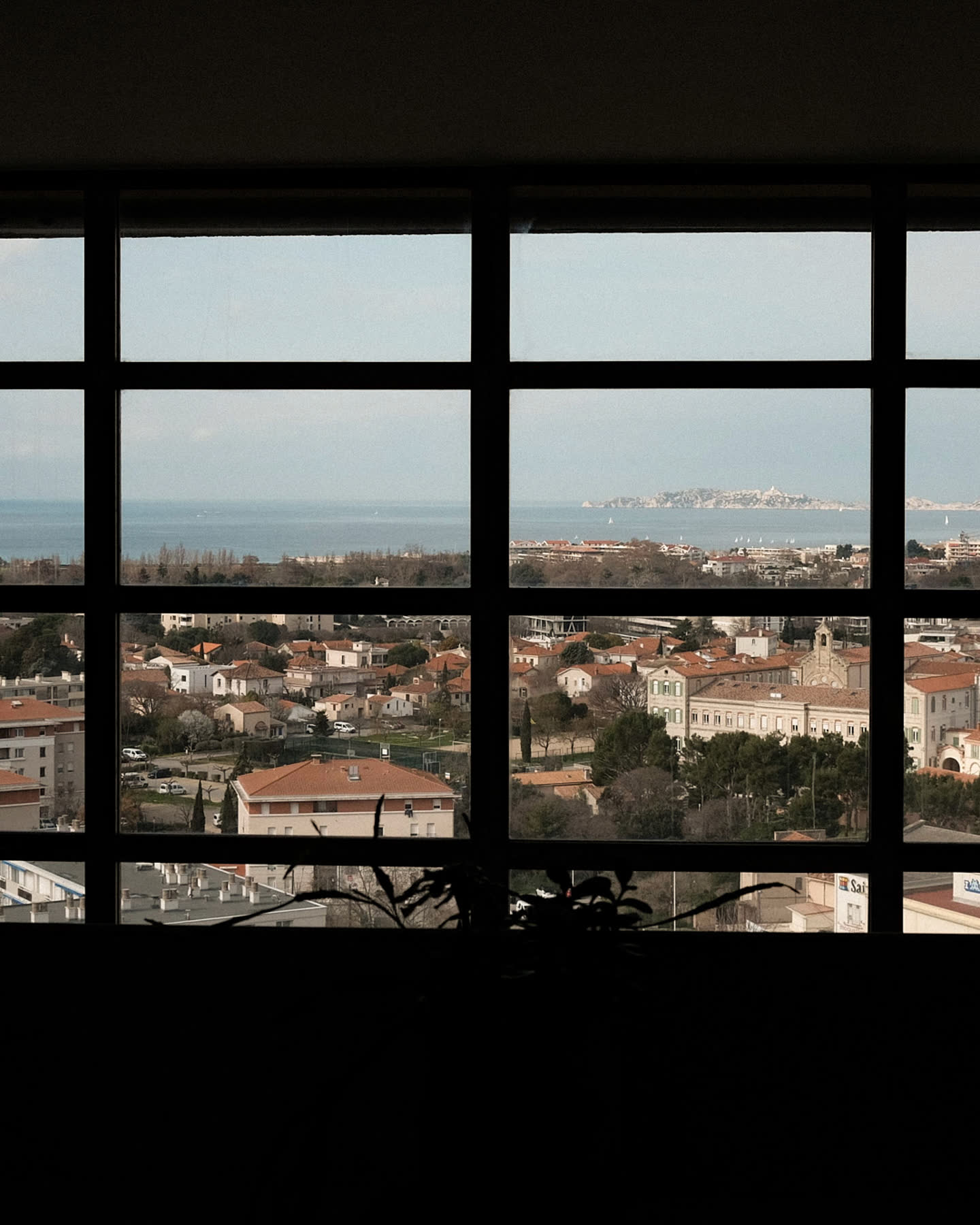 The view across Marseille framed by the windows of Cité Radieuse.