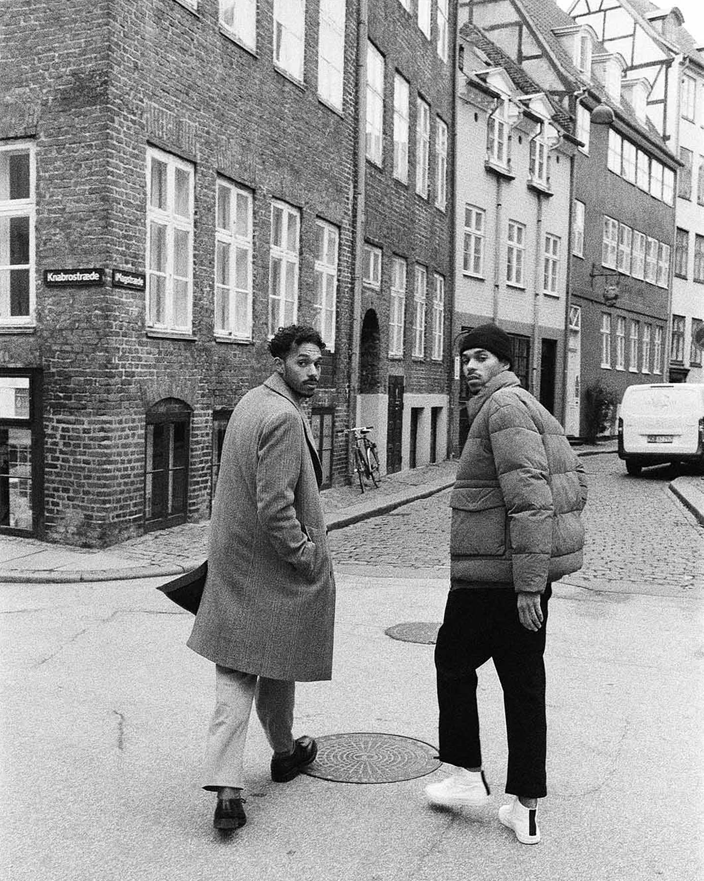Noél and Samuel Aiwerioghene walking through the cobblestone streets of Copenhagen for Zara.