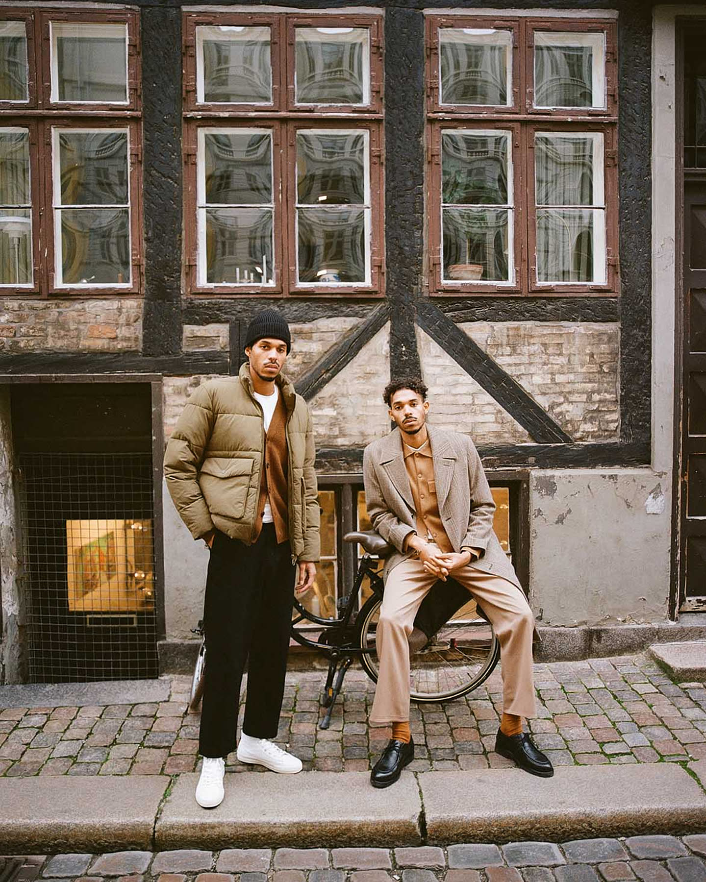 Noél and Samuel Aiwerioghene outside a Copenhagen building for Zara.