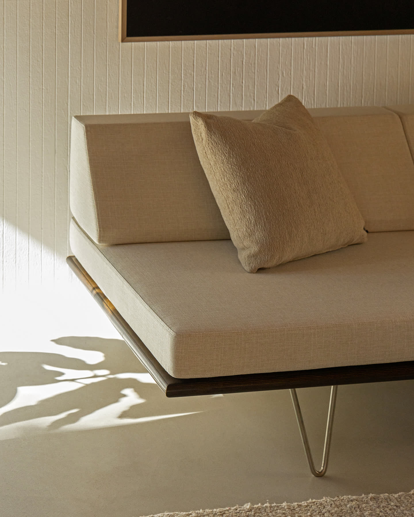 Close detail of a Modernica sofa in the Eichler Post & Beam living room.
