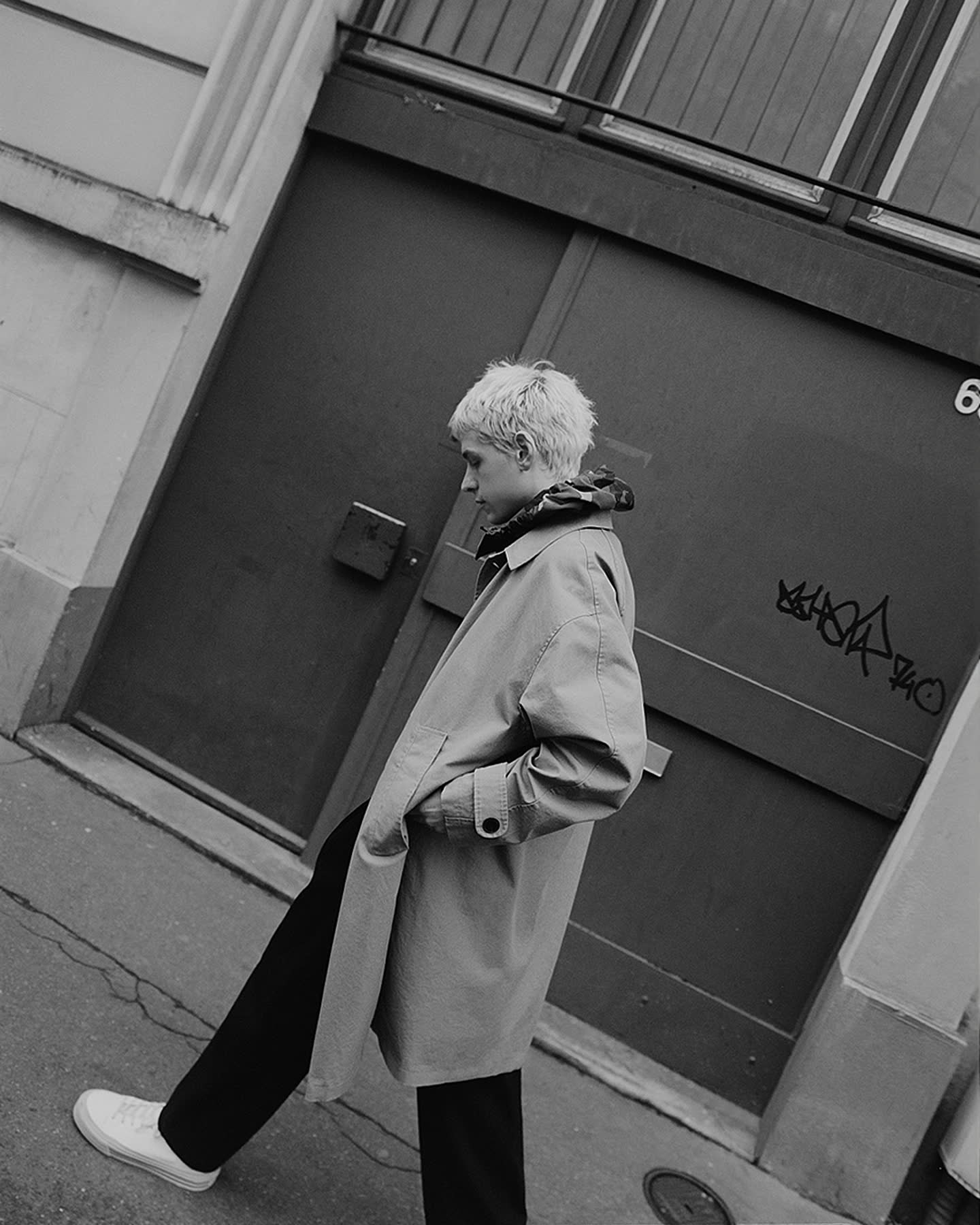 Henri Pier walking through a Paris street in winter for Flâneur.