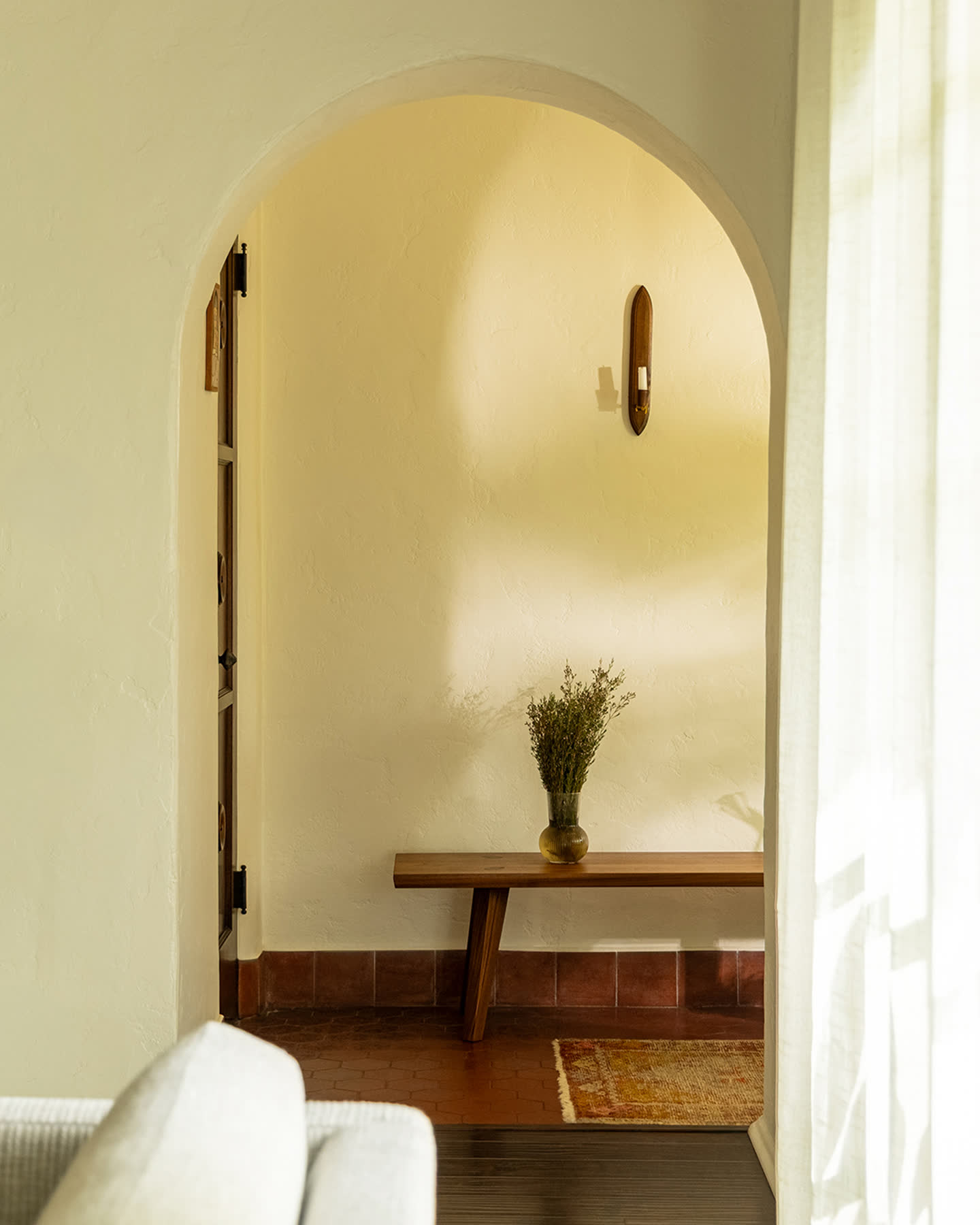 Ojai Collection bench in a sunlit arched interior.