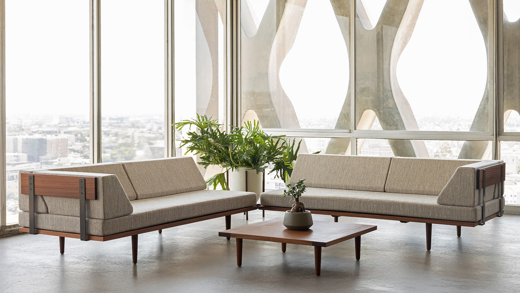 Solid Sapele seating collection arranged inside the American Cement Building.