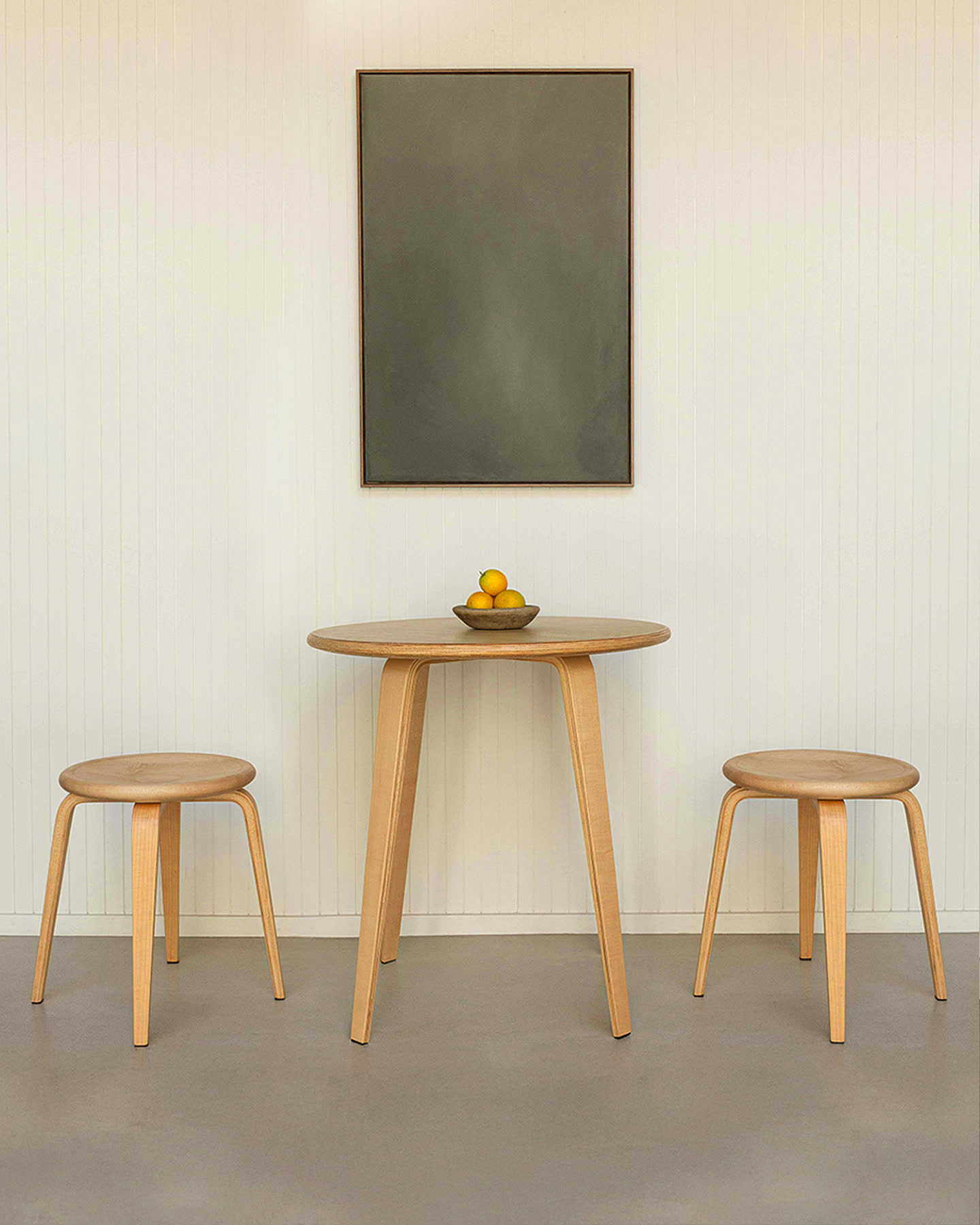 The maple Bistro Collection table and stools arranged as a set for Sunroom.