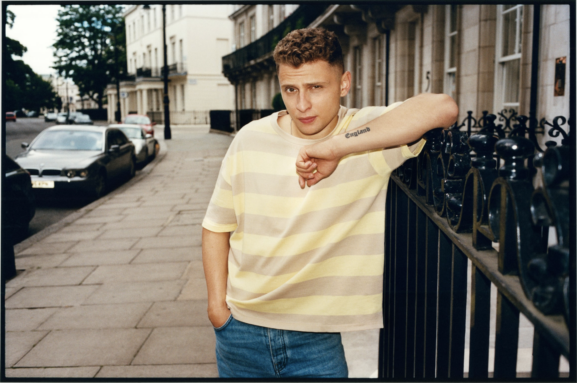 Blondey McCoy leaning against a London railing for Zara.